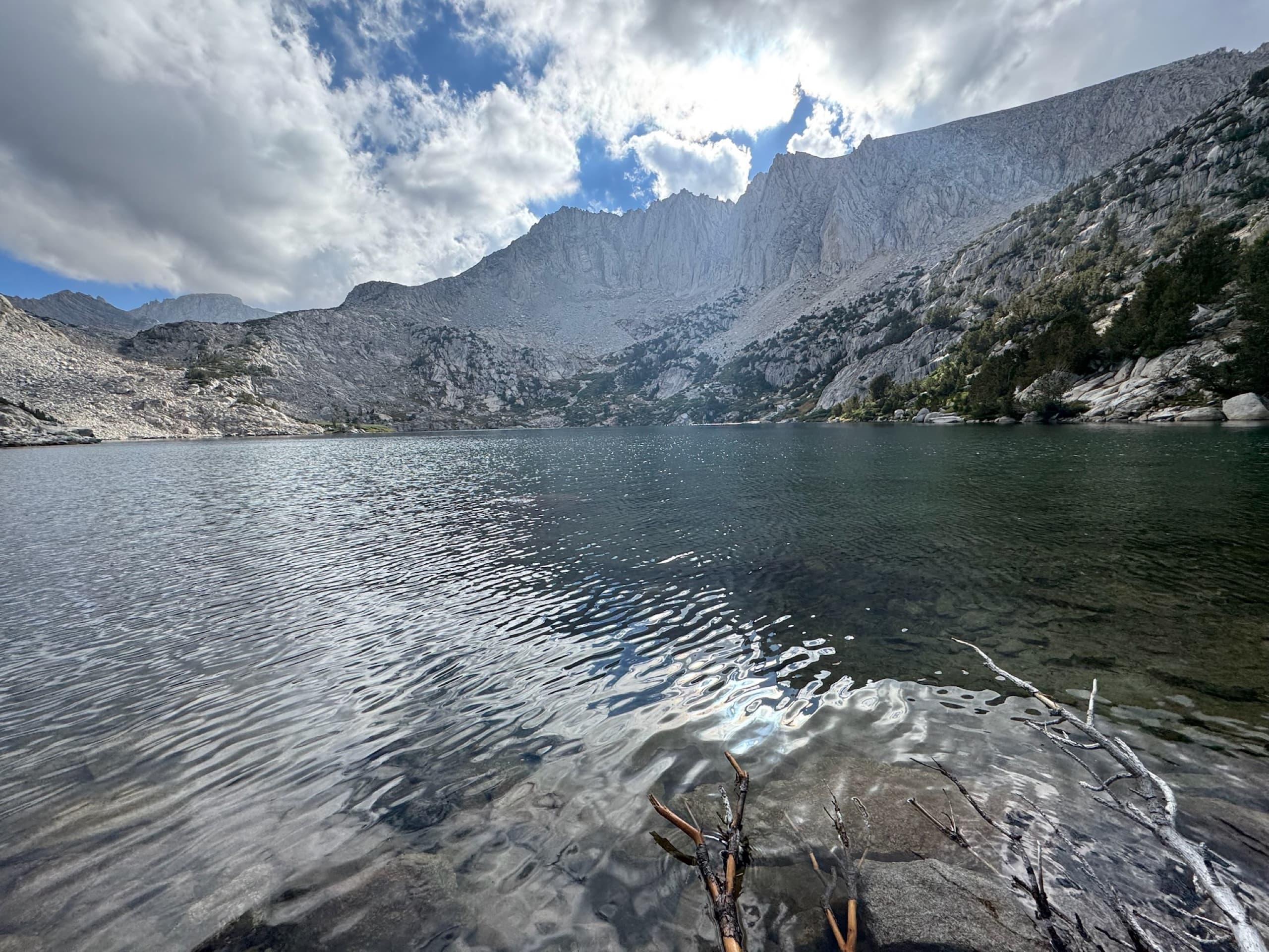 Alpine lake below a granite cirque, photographed on a backpacking trip